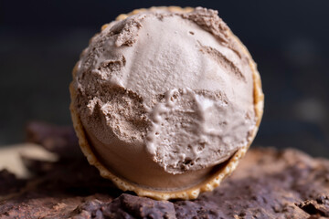 chocolate ice cream in a waffle cup on chocolate