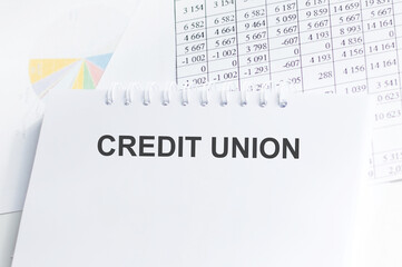 Credit Union. text on craft paper. notepad on notepad