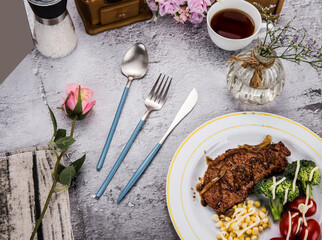 Stainless steel tableware and kitchen utensils placed on the desktop