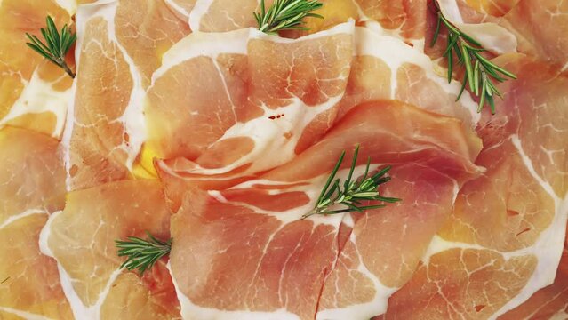Slices of dried ham, Italian cured pork meat.