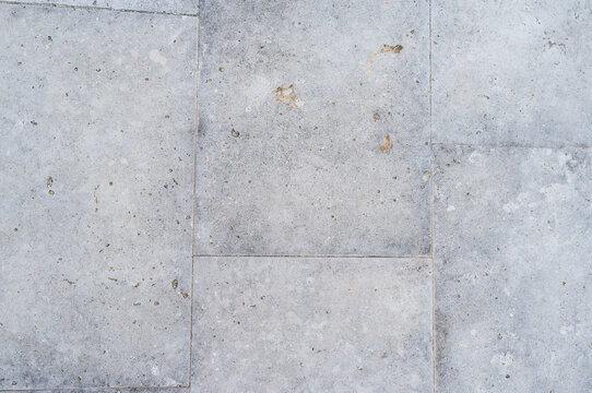 imagen detalle textura suelo de baldosas de cemento gris, con las juntas muy pegadas