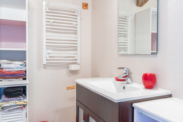 Fototapeta na wymiar Home bathroom, bright new bathroom interior with tiled glass shower, vanity cabinet, interior designed, towel storage cabinet