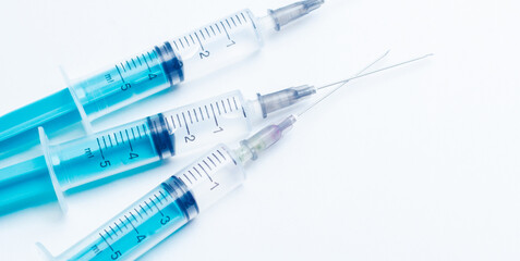 Disposable plastic syringe prepared for injection and vaccination in the hospital. The concept of...