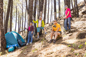 Fototapeta premium Senior hiking group, portrait and smile in nature, forest and happy for adventure together in summer.