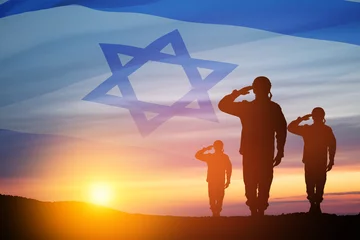 Foto op Plexiglas Silhouette of soldiers saluting against the sunrise in the desert and Israel flag. © hamara