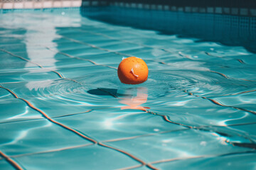 A pool with a orange in it and water on the bottom. AI generation