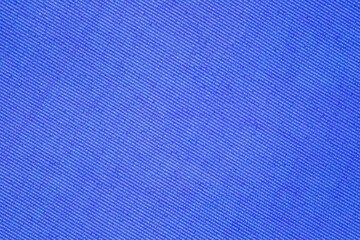 Fototapeta na wymiar Background of blue fabric close-up, uniform texture