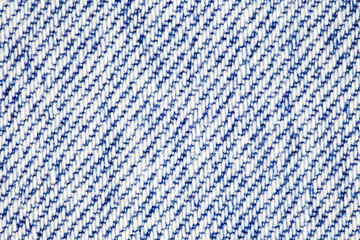 Background, denim fabric close-up, white and blue threads, uniform texture