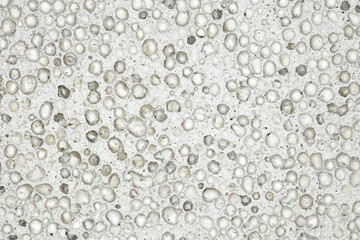Pumice stone, background, structure of porous surface in close-up, uniform texture