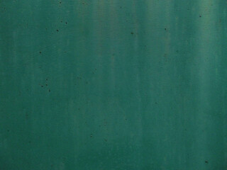 green background painted metal, slightly faded paint that has lost its original color