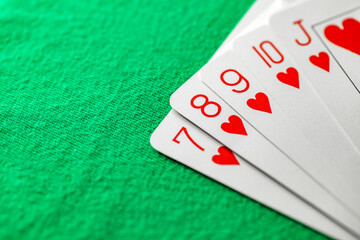Playing cards, straight flush poker combination, from seven to jack of red suit of hearts