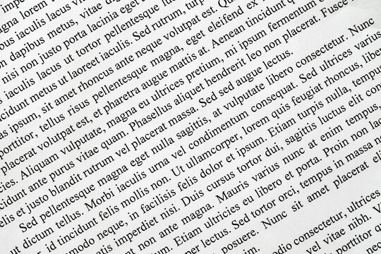 Lorem Ipsum text printed on white paper close-up diagonally, example document