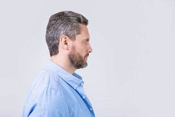 profile view of bearded man with beard isolated on grey background. bearded man