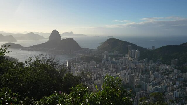Rio de Janeiro from above during a beautiful summer morning. 4K video with the skyline of Rio city, view to Sugar Loaf landmark and Copacabana beach. Travel to Brazil.