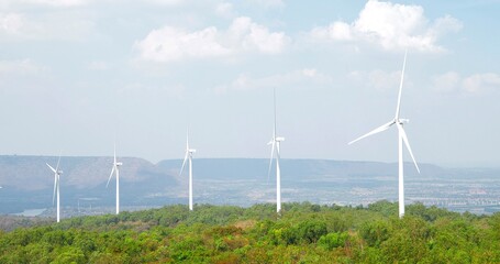 Beautiful sunny and wind turbine mountain landscape. Wind turbines on top of a mountain. Wind energy, Wind power, renewable energy