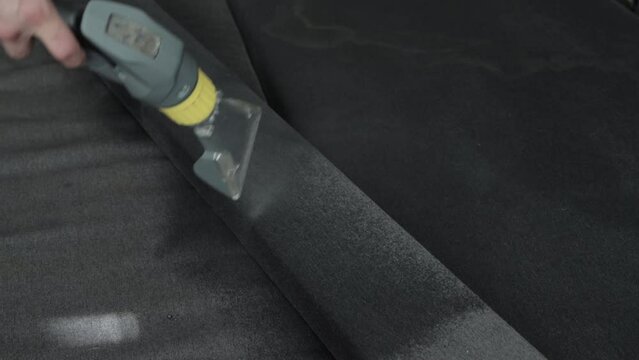 Professional dry cleaning of the sofa with a special chemical solution and a washing vacuum cleaner. Copy space for text