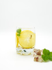 Glass of lemonade with straw isolated on a white background
