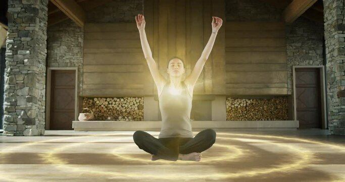 Beautiful Relaxed Caucasian Woman Meditating In Zenlike Openair Space. Animated Visualization Of Bright Energy Accumulating In Her Chest. Yoga Practice, Self-care, And Mindfulness Concept.