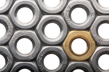 Metallic hex nuts layed out in a hexagonal pattern, industrial background. All steel and one brass nut. Png clipart isolated cut out on transparent background