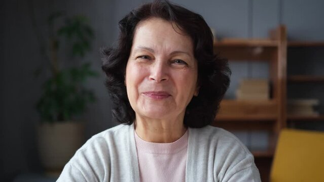 Portrait of confident stylish european middle aged senior woman. Older mature 60s lady smiling at home. Happy attractive senior female looking camera close up face headshot portrait. Happy people