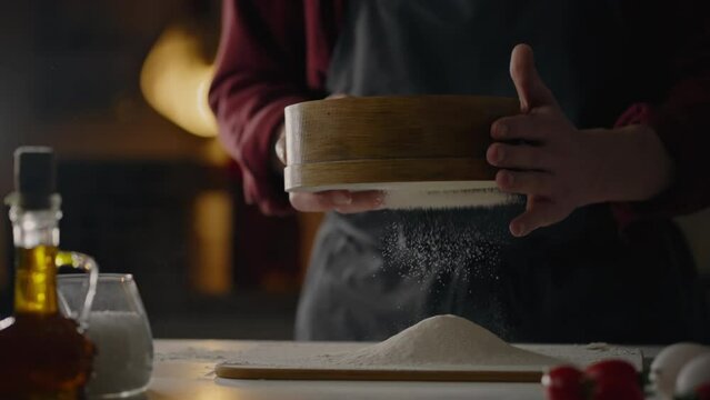 Pizzeria, Professional baker with experience Sifting flour through a sieve Baking department Restaurant worker for unique dishes Sifting flour to get rid of lumps. in a professional workshop, Bread
