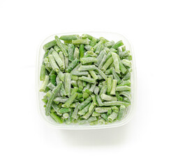 Frozen cut green beans in square plastic bowl on white background. Top view. Square format.
