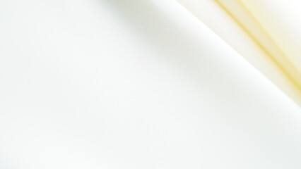 abstract background elegant light yellow fabric wave wavy fold grunge satin material velvet blurred or berry