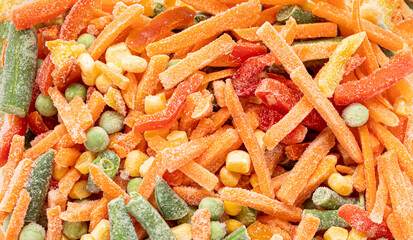 Set of frozen cut vegetables close up as background. Top view. Horizontal format.