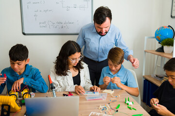 Robotics teacher teaching about electronic circuits