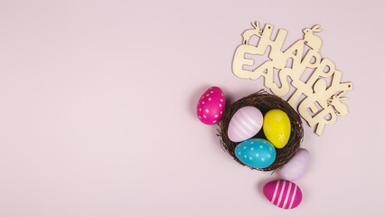 Art Happy Easter concept. Frame of Easter eggs, greeting card and on pink background. Flat lay, top view, banner