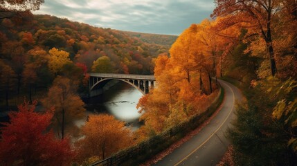 A curving road with a bridge over a river below surrounded by fall foliage. Generative AI