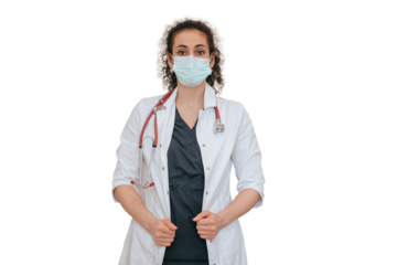 Confident female nurse in medical clothes wearing face mask looks at camera standing against transparent background. Medicine, treatment concept. American doctor waits for patient.