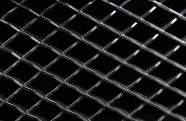 chrome metal grill on a black background