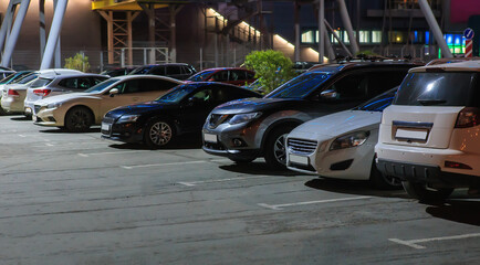 Cars in the parking lot at night - 598593998