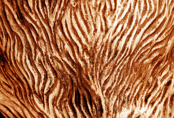 Metal rough surface with blur effect in orange tone.