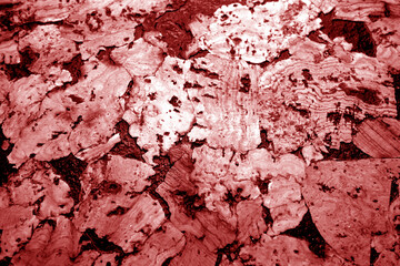 Cork board texture in red tone.