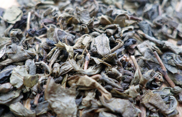 Green tea leaves close up with blur effect.