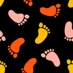 Black seamless pattern with colorful footprints.