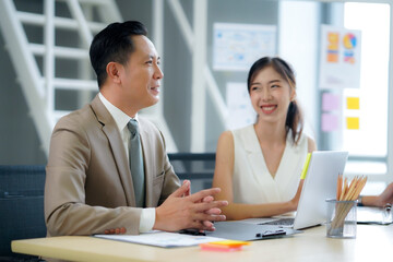 ฺฺBusiness 
 Successful businessman presenting work plan analytical report to colleagues in modern office