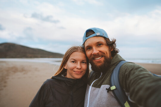 Romantic couple taking selfie Traveling together vacations lifestyle friends man and woman portrait happy smiling faces