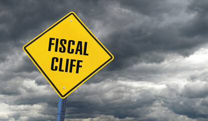 Yellow warning sign against a stormy sky