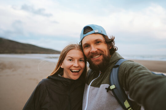 Couple in love taking selfie Travel lifestyle man and woman happy smiling at romantic vacations friends together