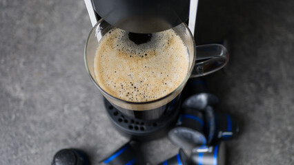 Automatic Coffee machine Glass of coffee and capsules