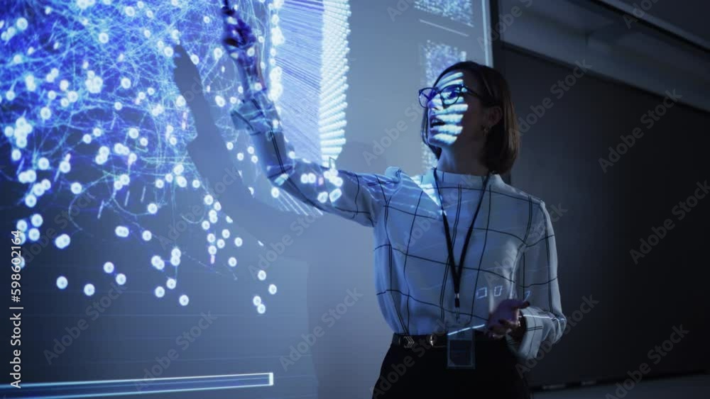 Poster young businesswoman giving a data science presentation in a dark auditorium with projecting slidesho