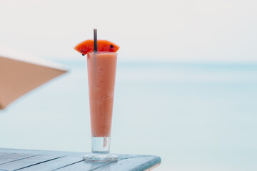 Smoothie watermelon on the beach in Thailand, fresh on the beach, the best drink on the beach - background, wallpaper