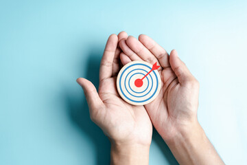 Hand objective focus to target icon which for planning development leadership and customer target...