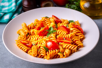 Fusilli pasta, spiral or spirali pasta with tomato sauce - Italian food style (Turkish name; domatesli, domates soslu burgu makarna)