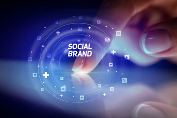 Finger touching tablet with social media icons concept