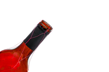 the neck of a open wine bottle isolated against white