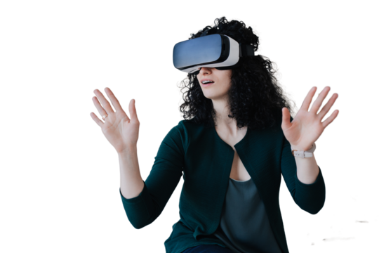 Curly-haired young woman in a green cardigan spreads her arms using virtual glasses at home resting after work against transparent background. Leisure activity.